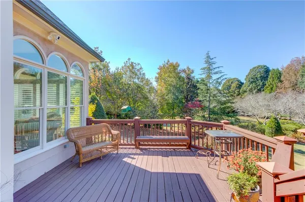 an aerial view of a house with a garden and swimming pool