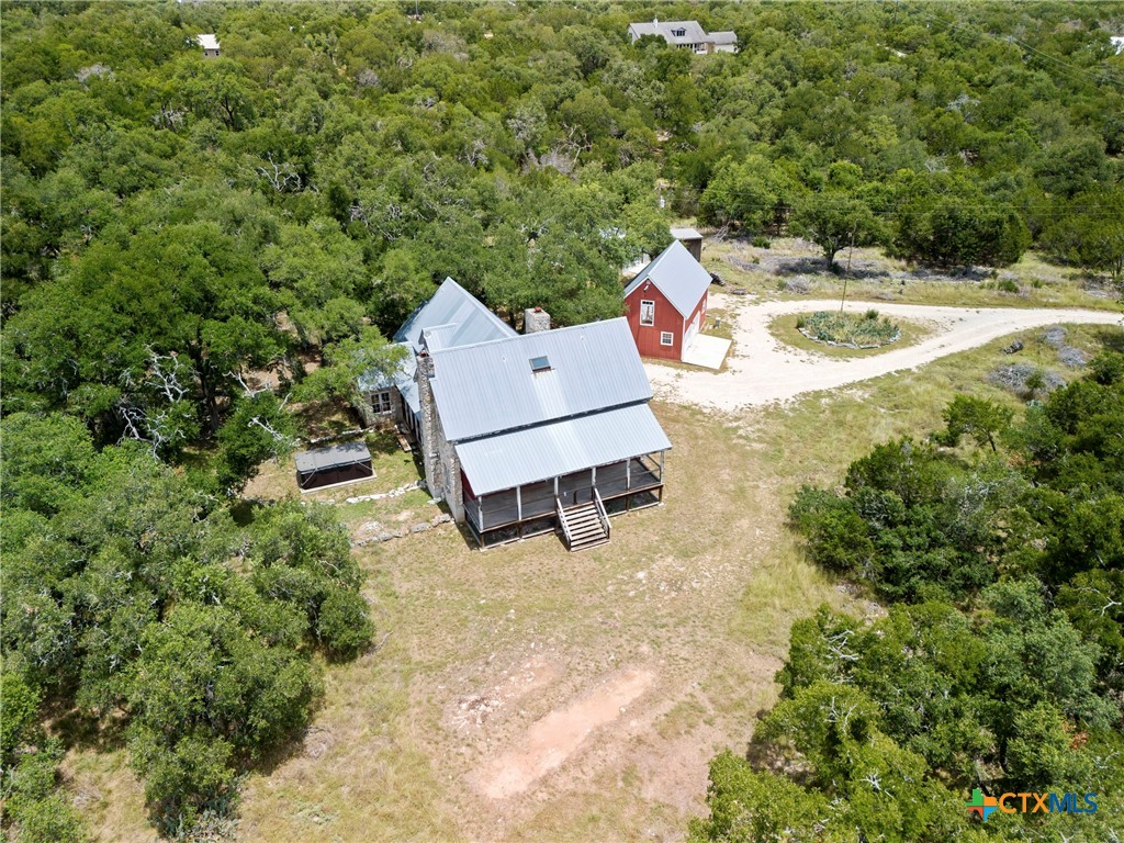 700 Camino De Rancho Wimberley, TX 78676 - Photo 2 of 41 view of a house with a yard and sitting area