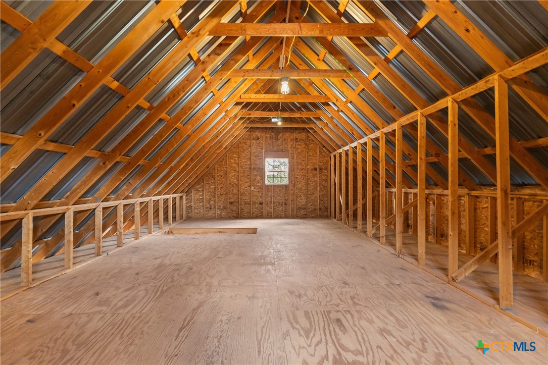 700 Camino De Rancho Wimberley, TX 78676 - Photo 38 of 41 a view of an empty room with wooden floor