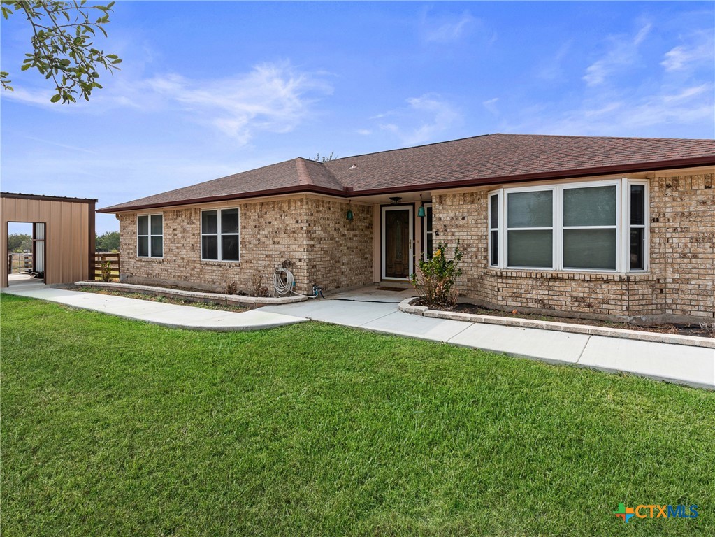 782 Santa Clara Loop Marion, TX 78124 - Photo 15 of 48 a front view of house with yard and outdoor seating