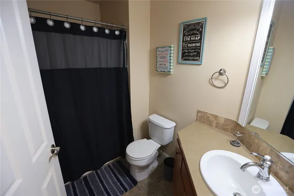 a bathroom with a toilet and a sink