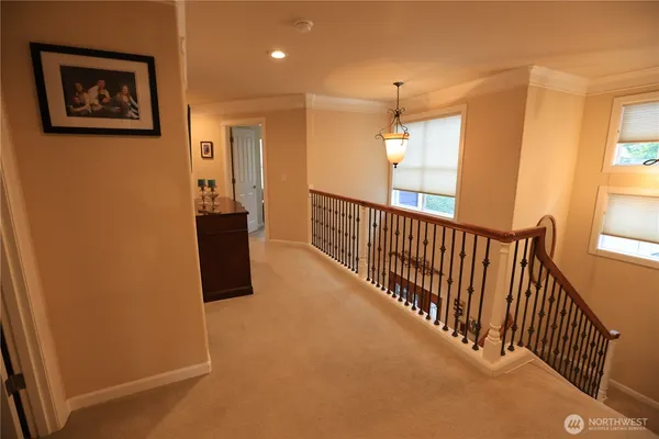 a view of a hallway with a dining room