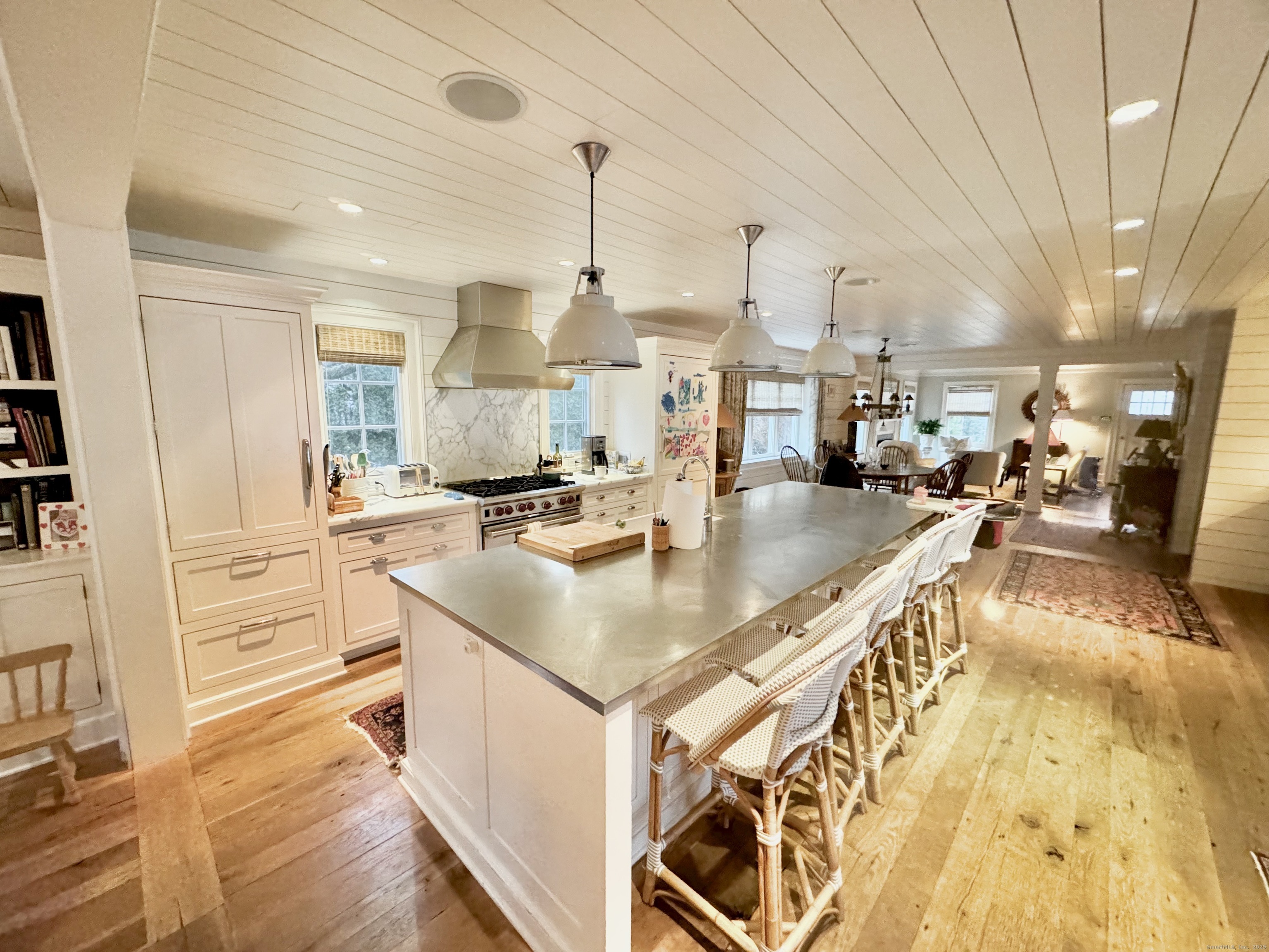 a kitchen with stainless steel appliances granite countertop a sink a counter top space and cabinets