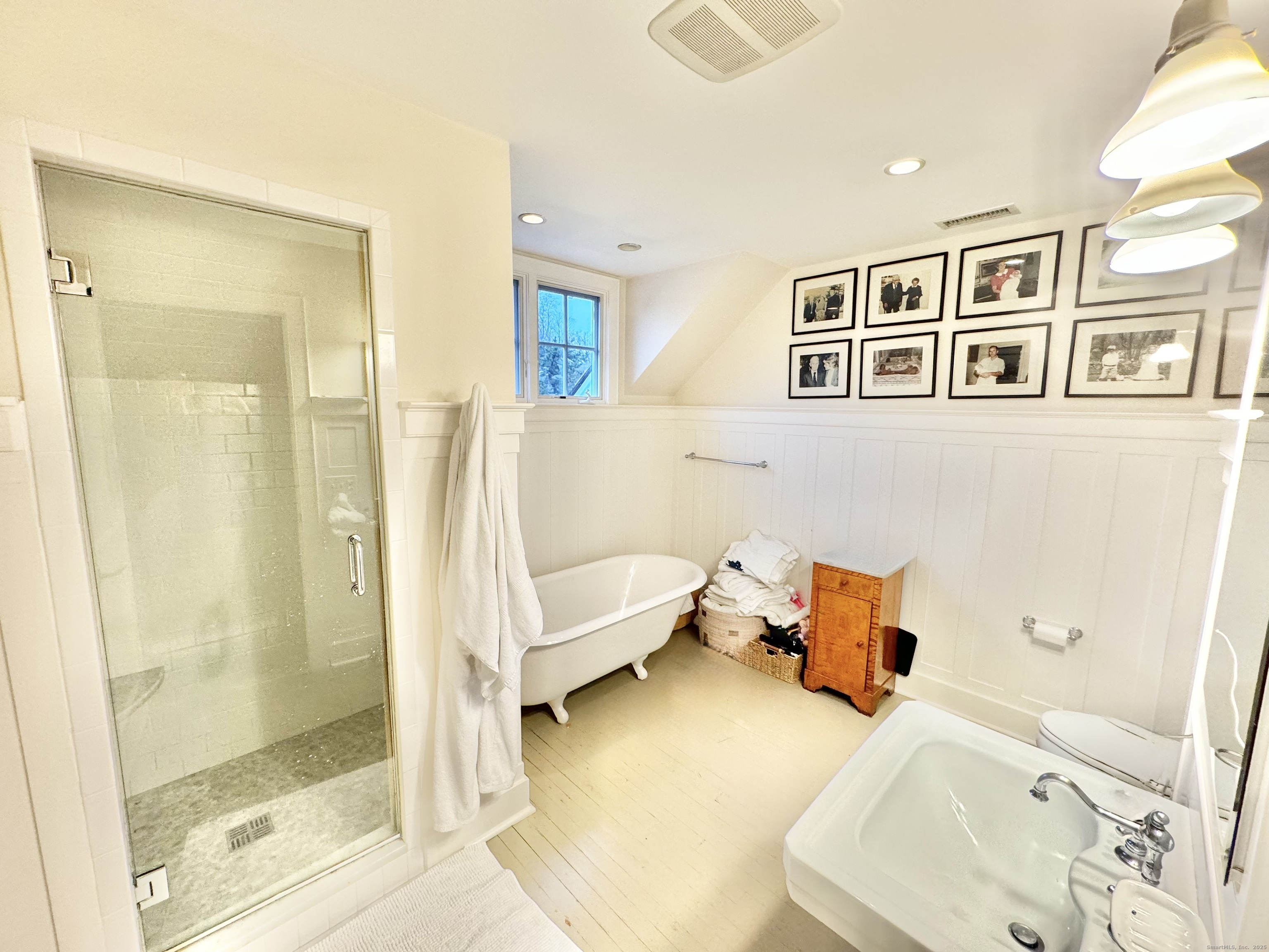 9 Barclay Court Norwalk, CT 06853 - Photo 13 of 16 a bedroom with a bed and wooden floor