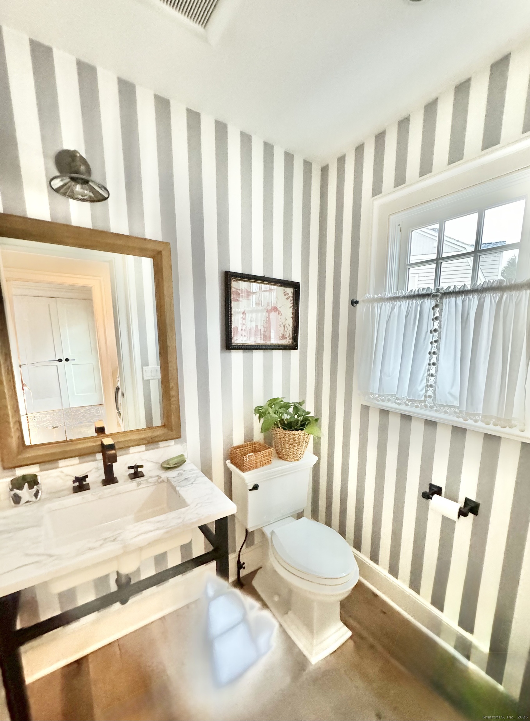 9 Barclay Court Norwalk, CT 06853 - Photo 16 of 16 a bathroom with a granite countertop sink and a large mirror