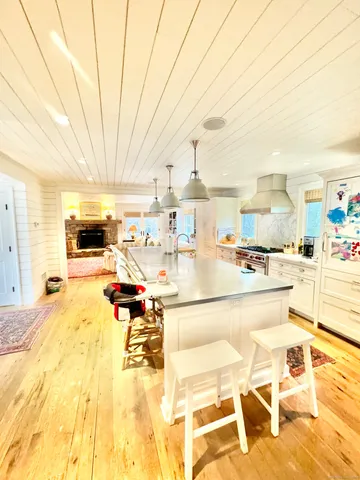 a living room with a table and chairs