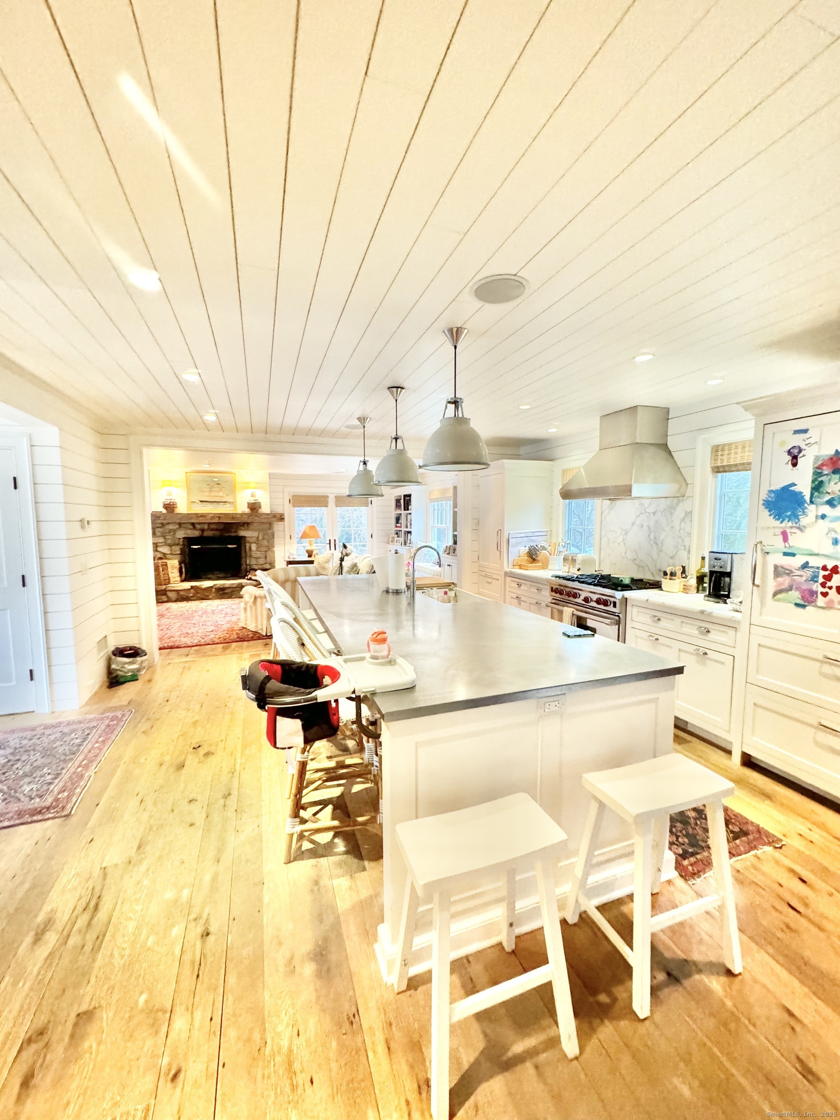 9 Barclay Court Norwalk, CT 06853 - Photo 3 of 16 a living room with a table and chairs