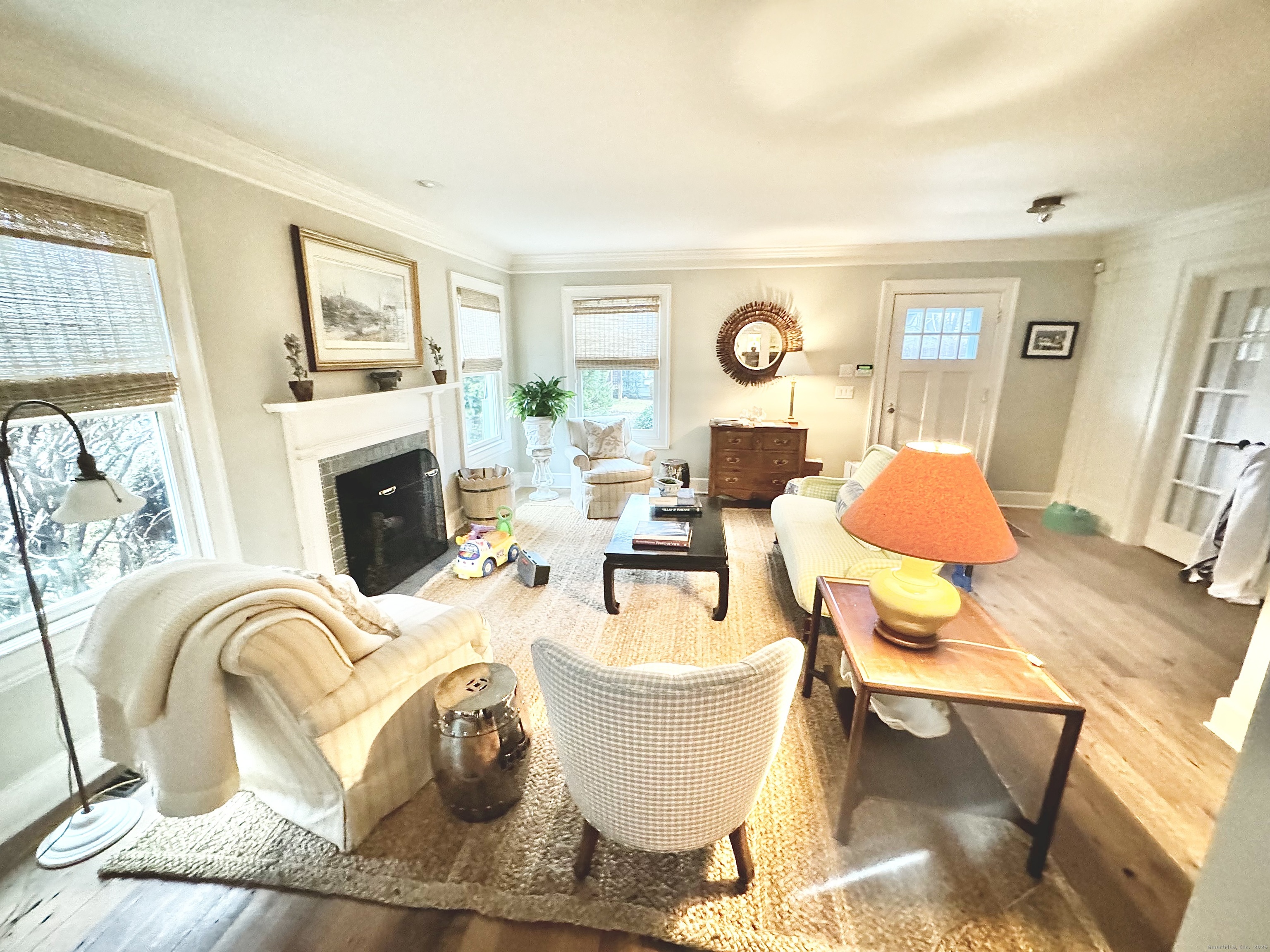 9 Barclay Court Norwalk, CT 06853 - Photo 6 of 16 a living room with furniture and a fireplace