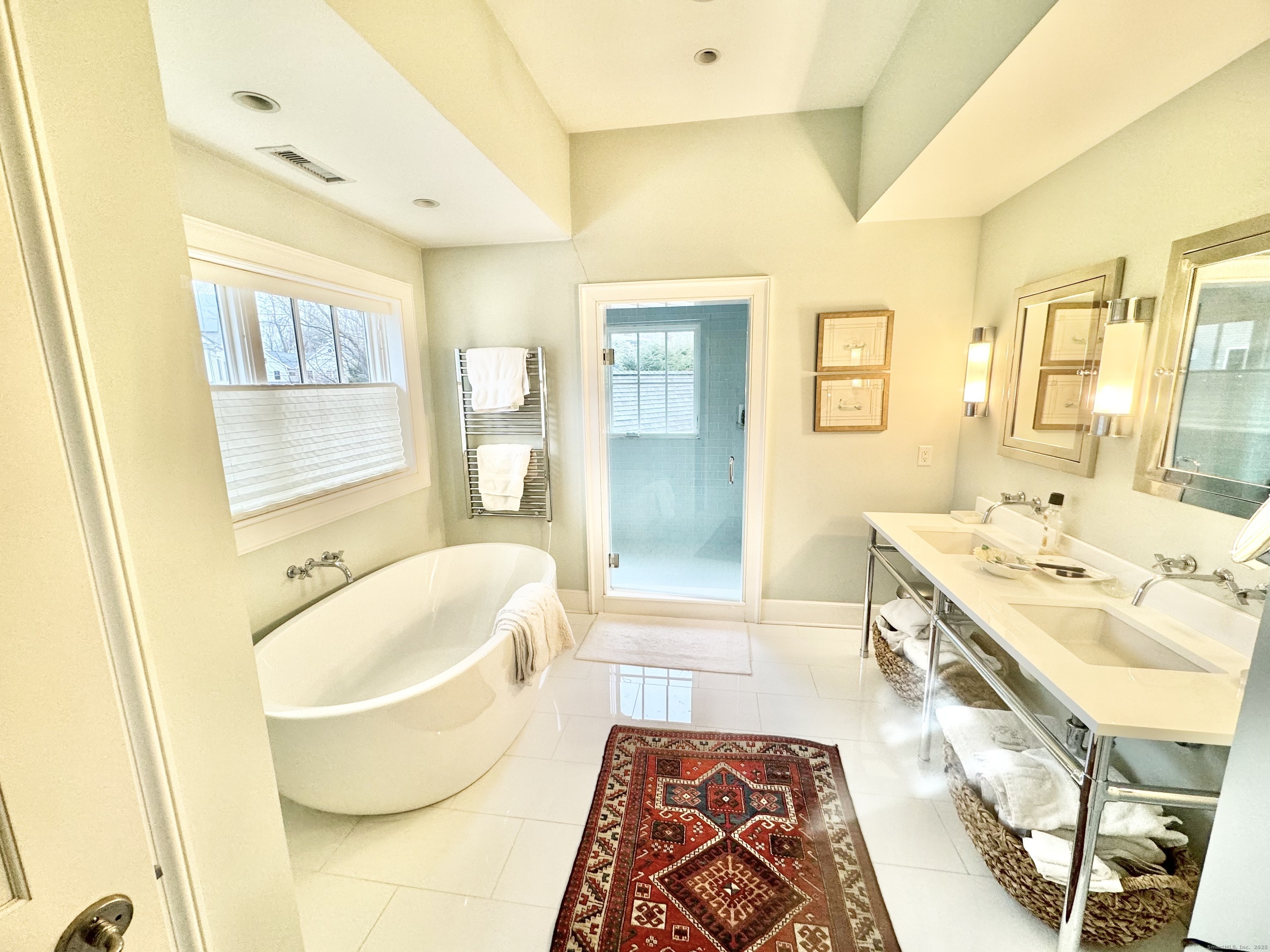 9 Barclay Court Norwalk, CT 06853 - Photo 9 of 16 a spacious bathroom with a tub sink and mirror