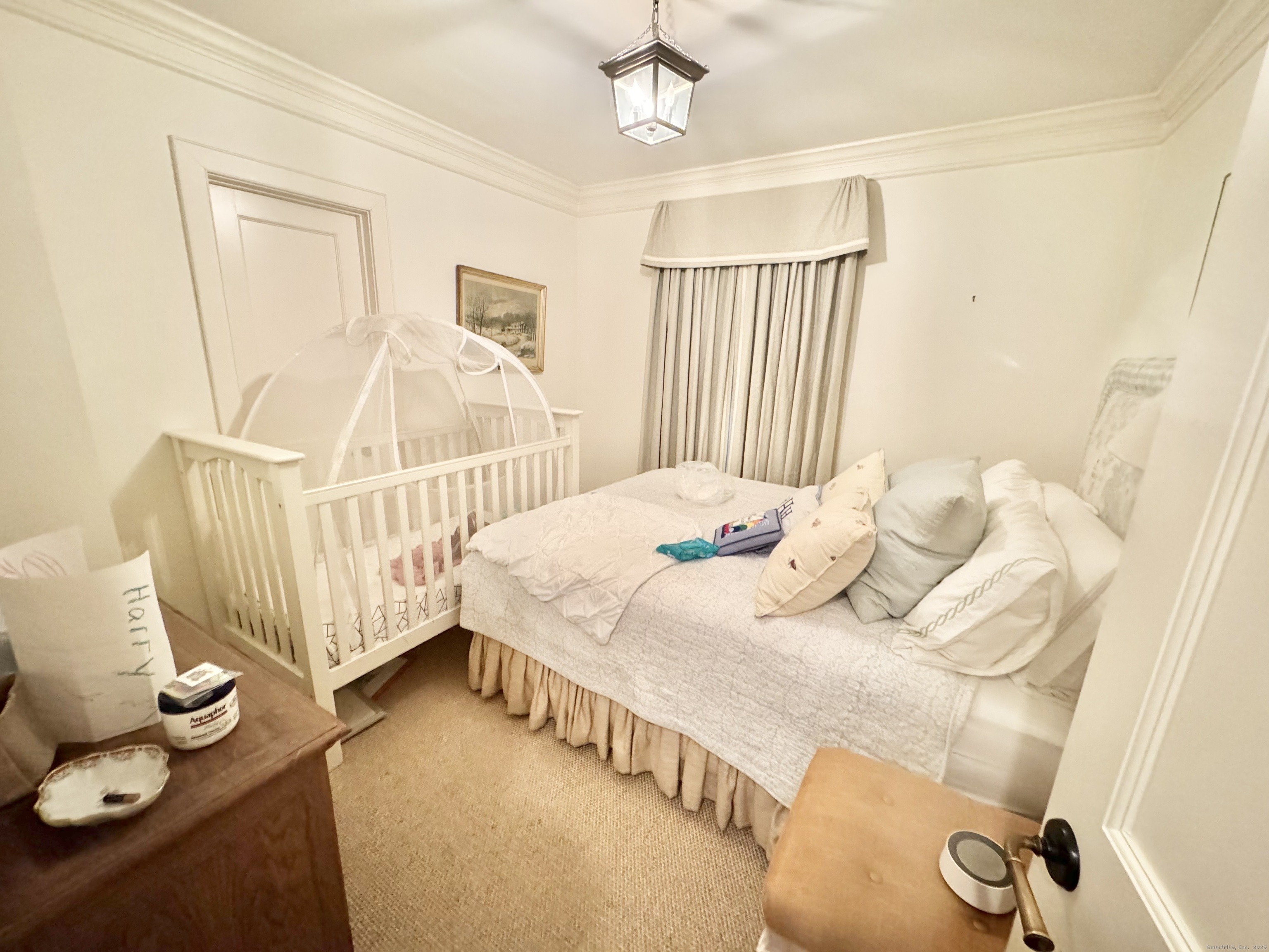 9 Barclay Court Norwalk, CT 06853 - Photo 10 of 16 a bedroom with a bed and a window