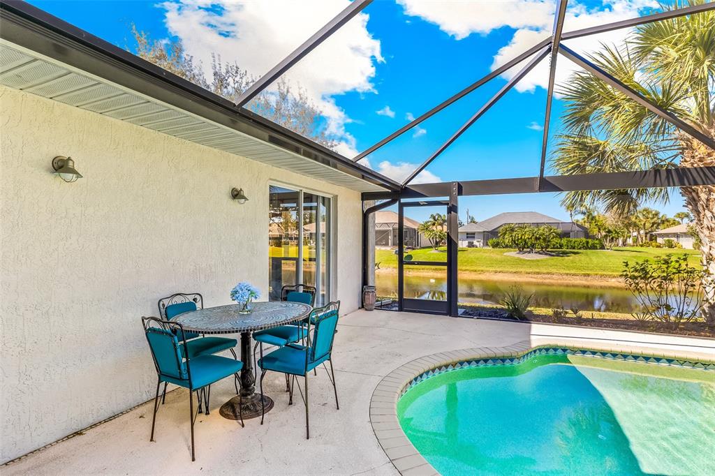 57 Marker Road Rotonda West, FL 33947 - Photo 20 of 27 a swimming pool with outdoor seating and yard