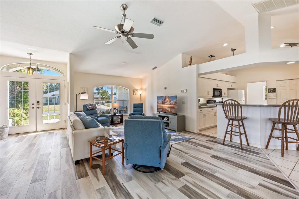 57 Marker Road Rotonda West, FL 33947 - Photo 2 of 27 a living room with furniture and kitchen view