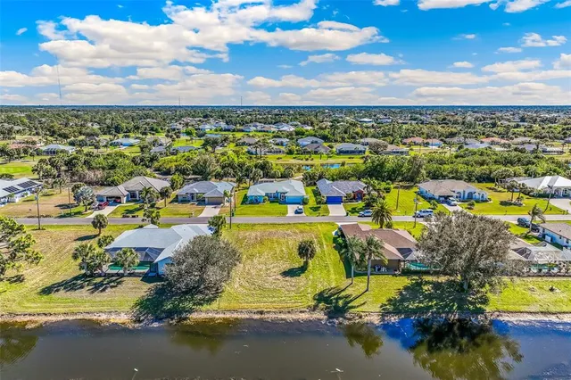 an aerial view of residential building and ocean