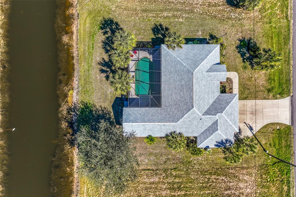 57 Marker Road Rotonda West, FL 33947 - Photo 24 of 27 an aerial view of a house with a yard and mountain view in back