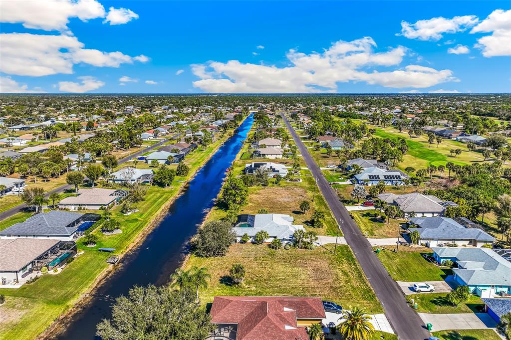 57 Marker Road Rotonda West, FL 33947 - Photo 25 of 27 an aerial view of residential building and ocean