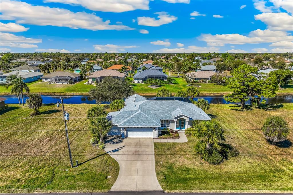 57 Marker Road Rotonda West, FL 33947 - Photo 27 of 27 an aerial view of residential houses with outdoor space and swimming pool