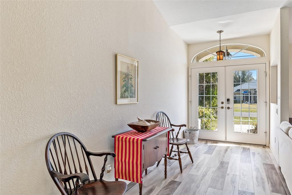 57 Marker Road Rotonda West, FL 33947 - Photo 5 of 27 a view of a dining room with furniture window and wooden floor