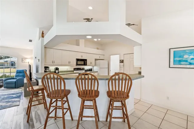 a kitchen with a sink a stove and refrigerator