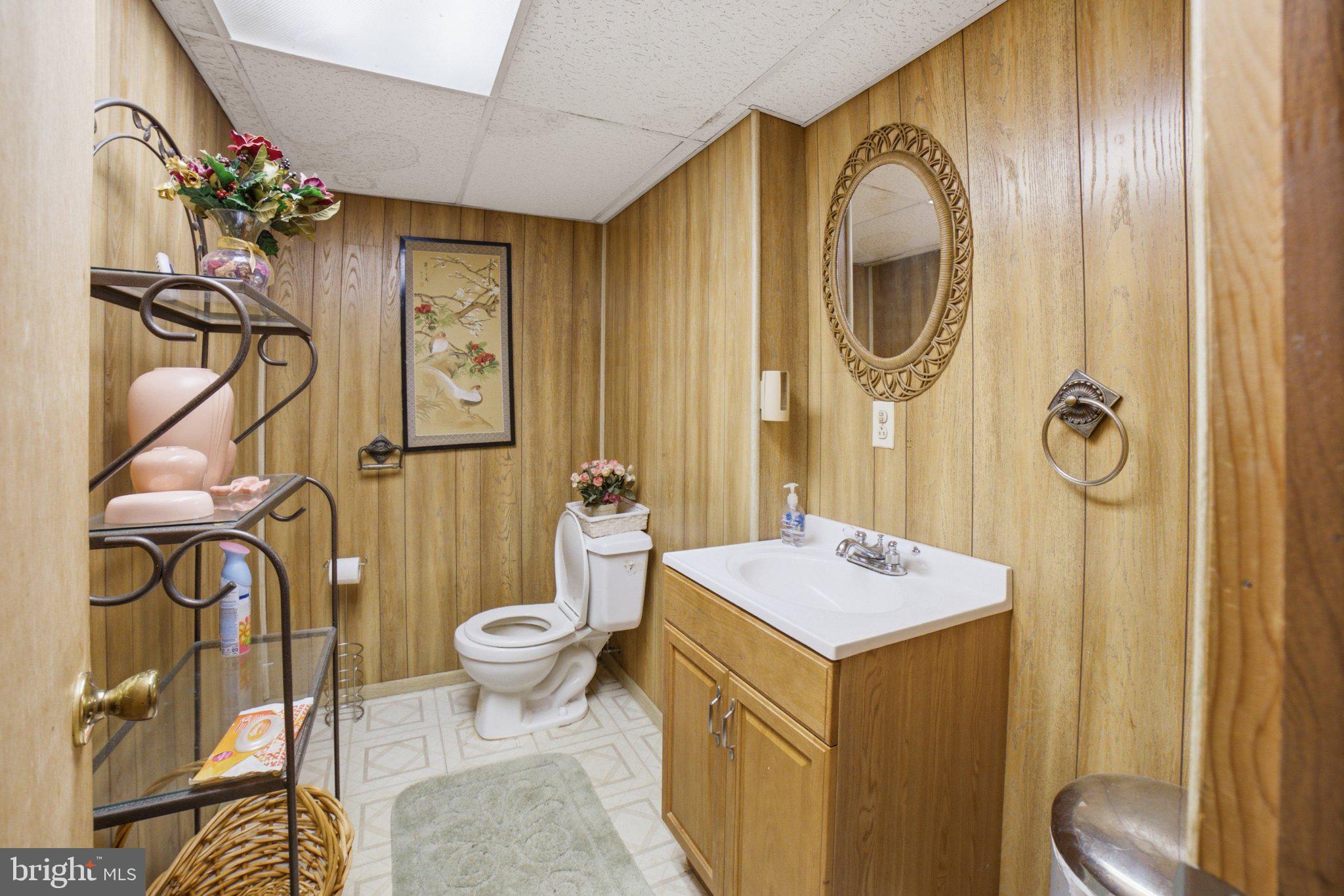 907 Logwood Road Capitol Heights, MD 20743 - Photo 13 of 16 Cozy bathroom with vintage charm.