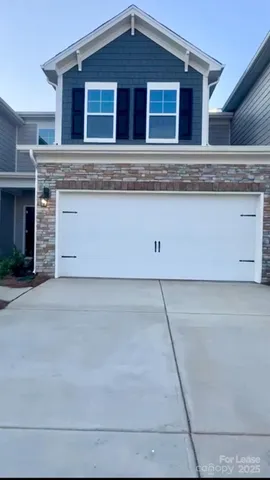 a view of a house with a garage