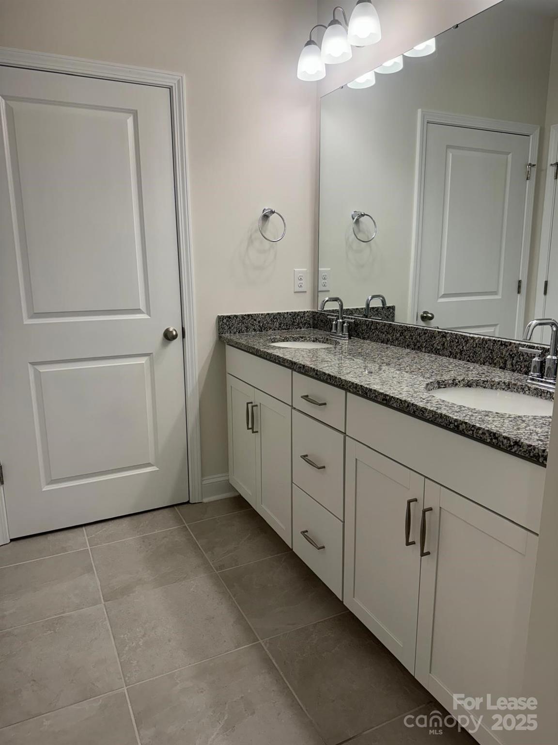 7870 Iron Road Sherrills Ford, NC 28673 - Photo 11 of 22 a bathroom with a granite countertop sink and a mirror