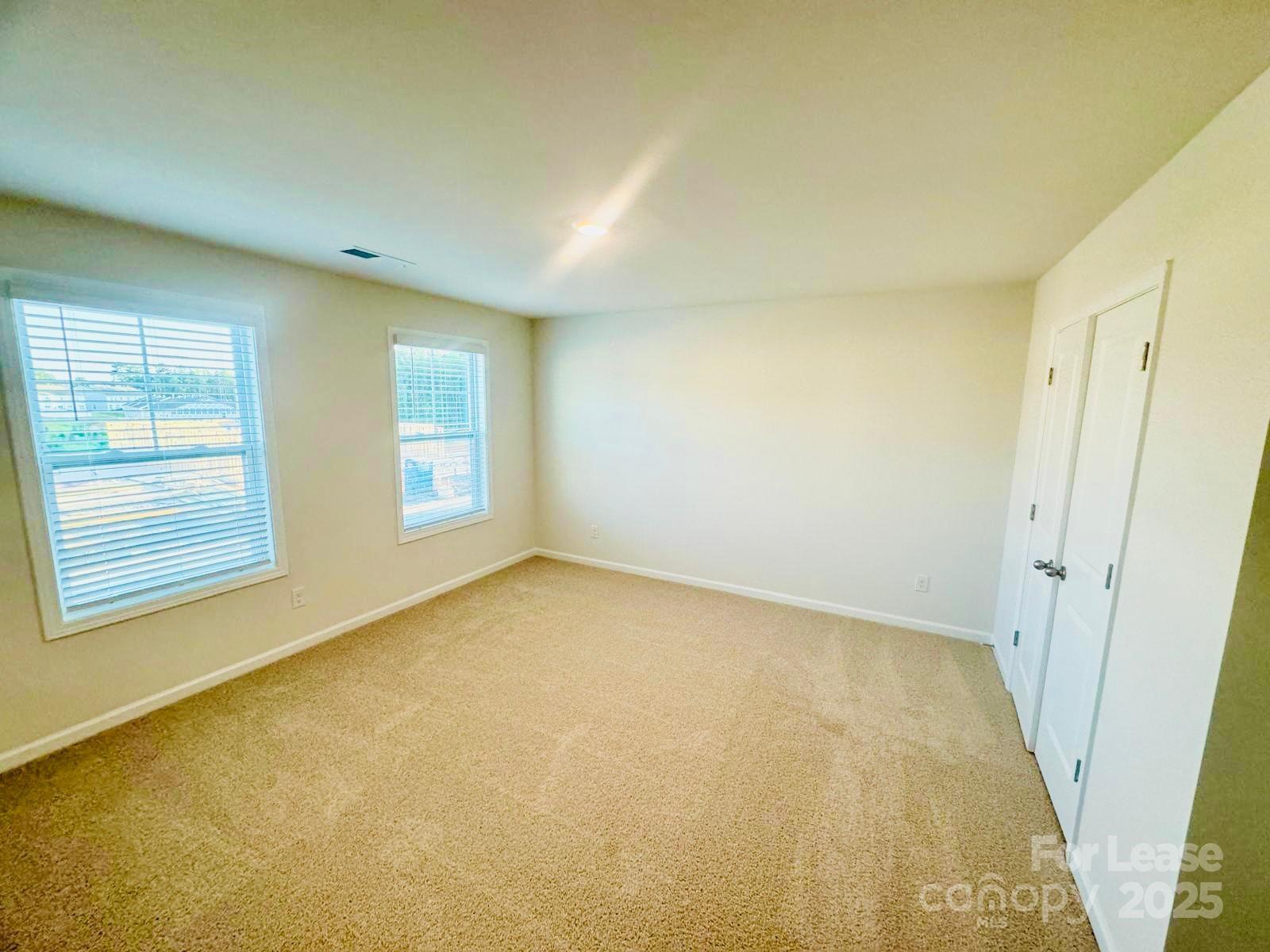 7870 Iron Road Sherrills Ford, NC 28673 - Photo 17 of 22 an empty room with windows