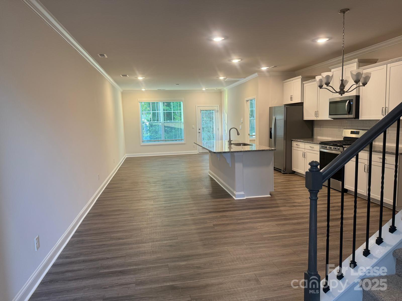 7870 Iron Road Sherrills Ford, NC 28673 - Photo 6 of 22 a view of entryway and kitchen with wooden floor