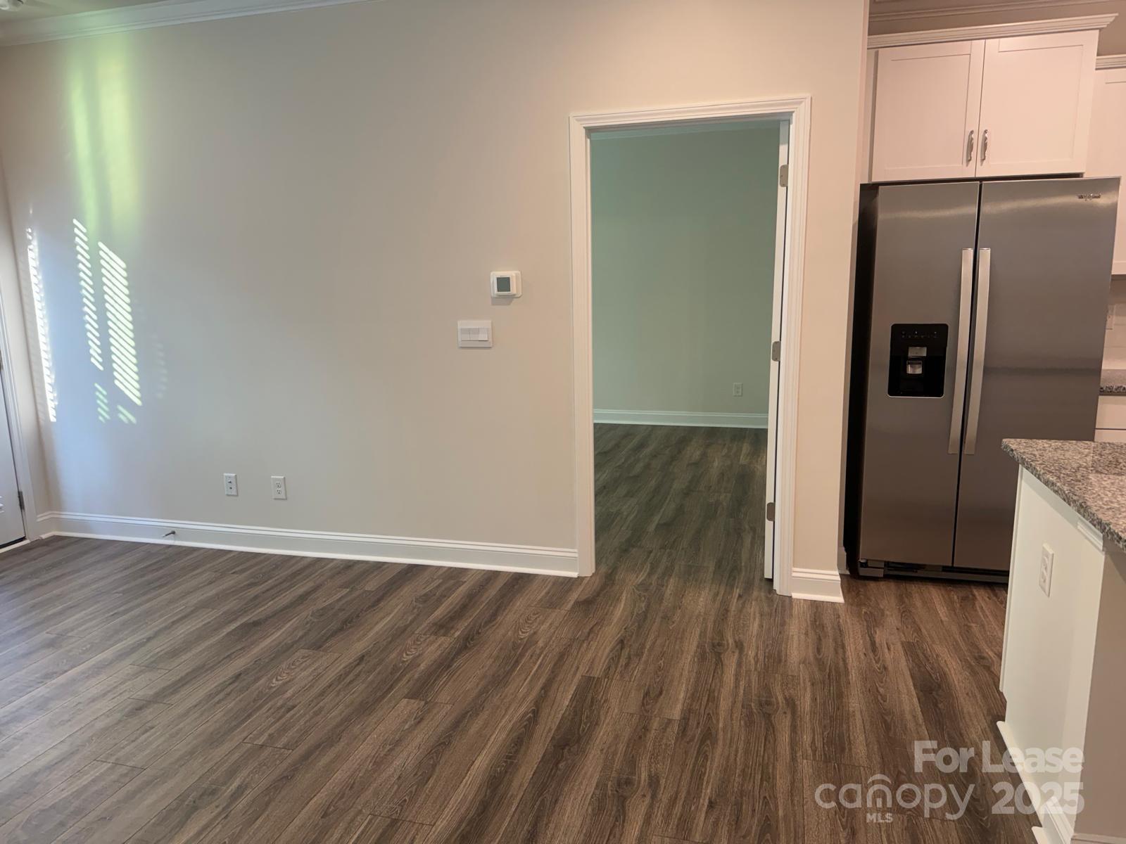 7870 Iron Road Sherrills Ford, NC 28673 - Photo 7 of 22 a view of a kitchen with wooden floor and a refrigerator