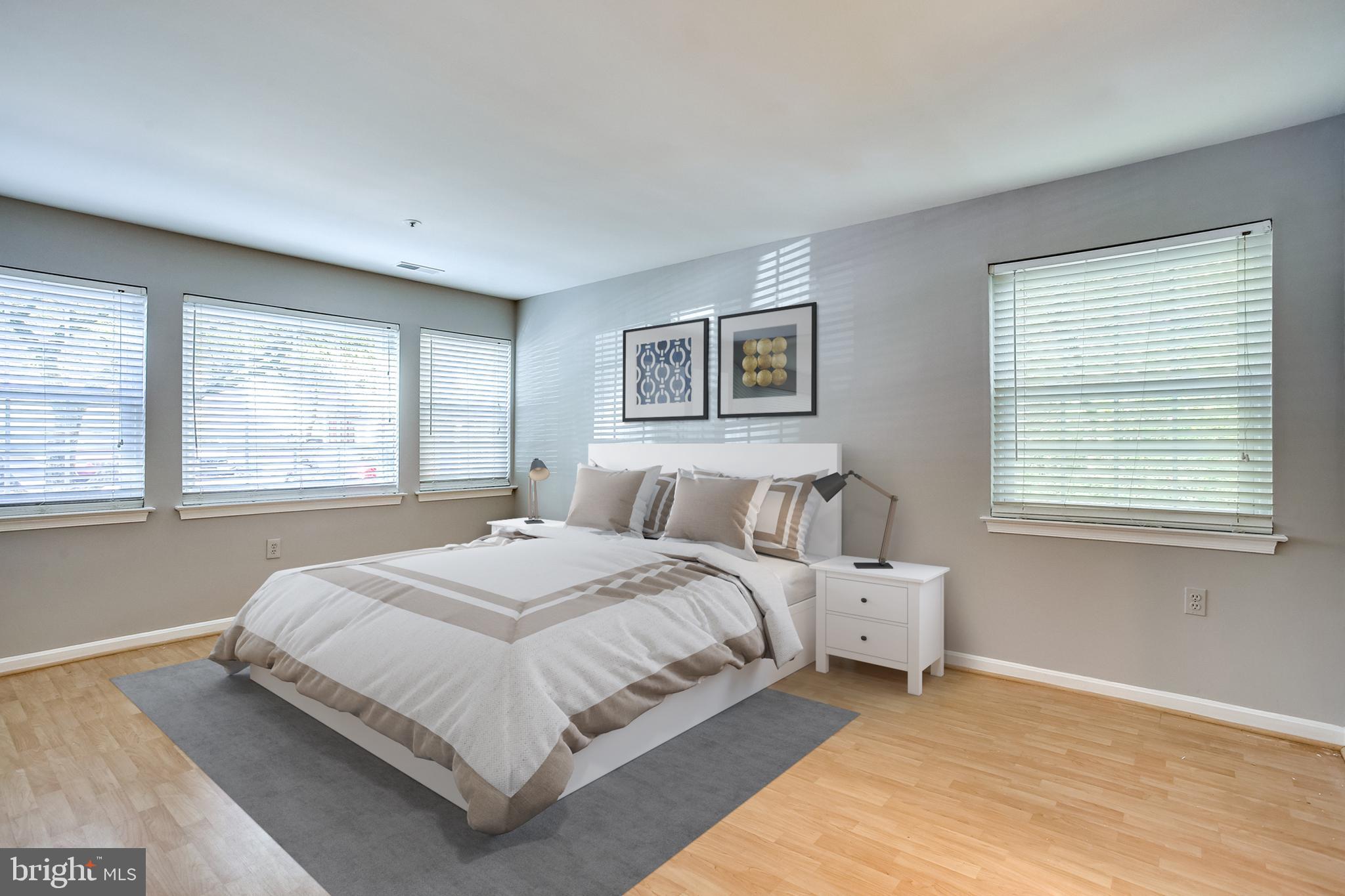 8384 Montgomery Run Road, Unit A Ellicott City, MD 21043 - Photo 13 of 29 Owner's bedroom w/wall of windows-virtually staged