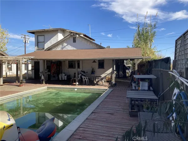 a view of a swimming pool with a patio