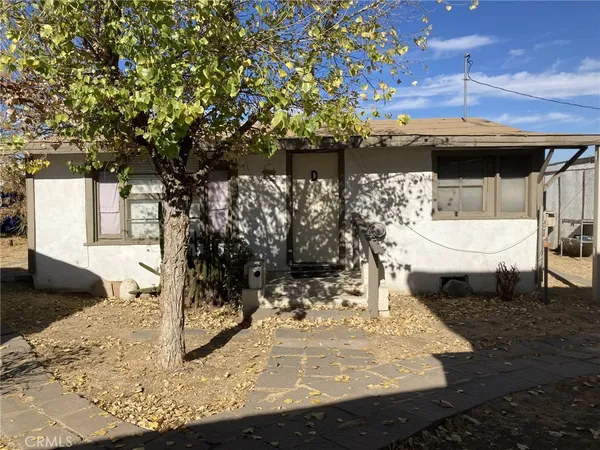 a view of a backyard of the house