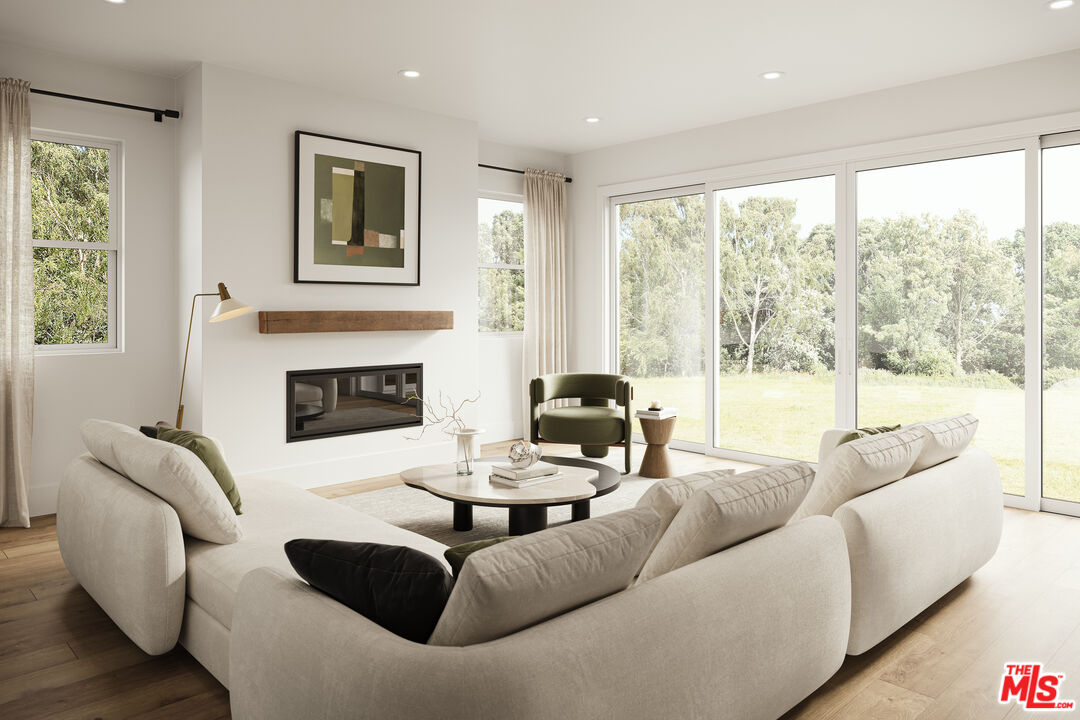 2807 Cardiff Avenue Los Angeles, CA 90034 - Photo 4 of 11 a living room with furniture and a fireplace