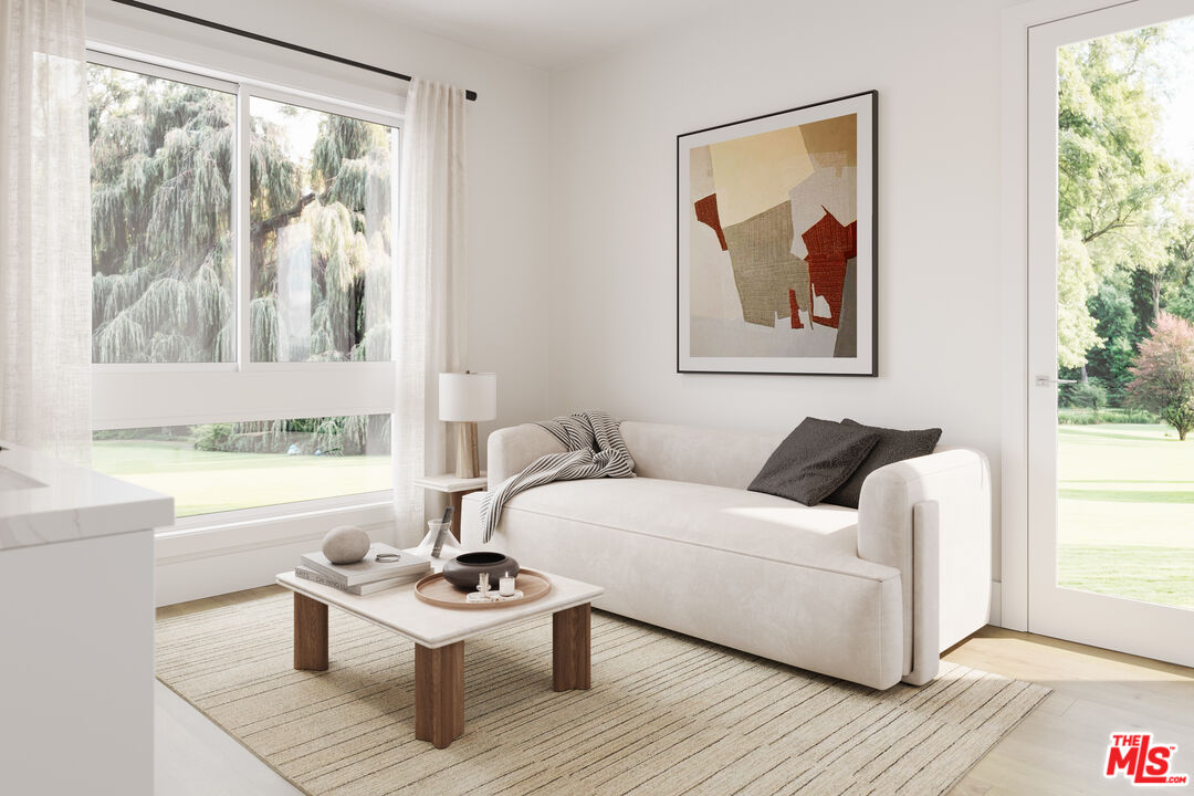 2807 Cardiff Avenue Los Angeles, CA 90034 - Photo 5 of 11 a living room with furniture and a large window