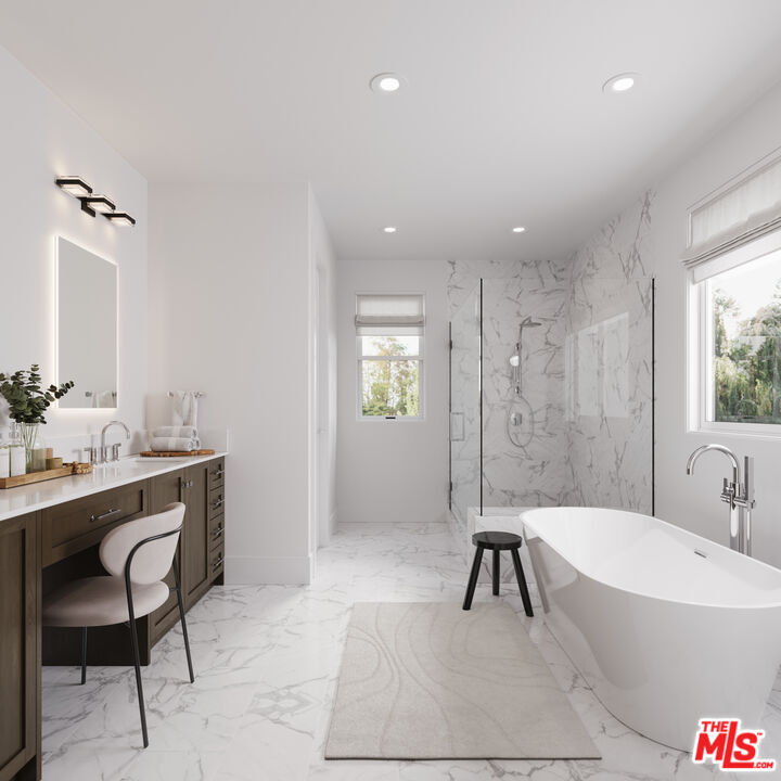 2807 Cardiff Avenue Los Angeles, CA 90034 - Photo 7 of 11 a bathroom with a bathtub a sink a mirror and a shower