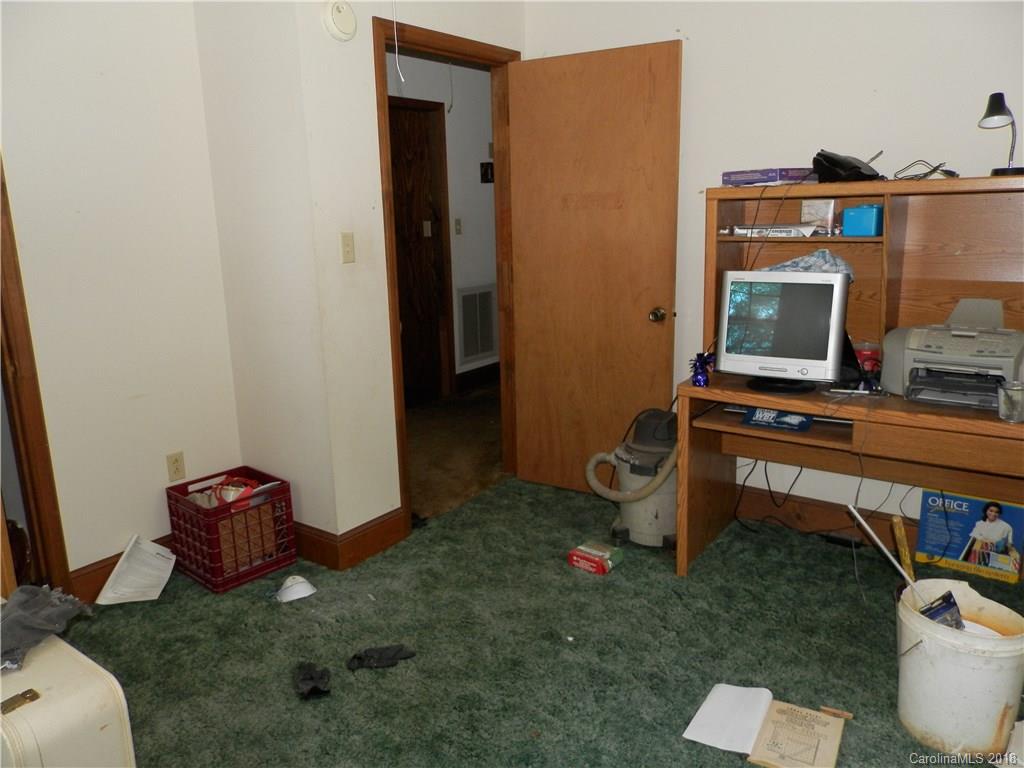 8313 Morgan Mill Road, Unit 1 Monroe, NC 28110 - Photo 22 of 31 a living room with furniture and a flat screen tv