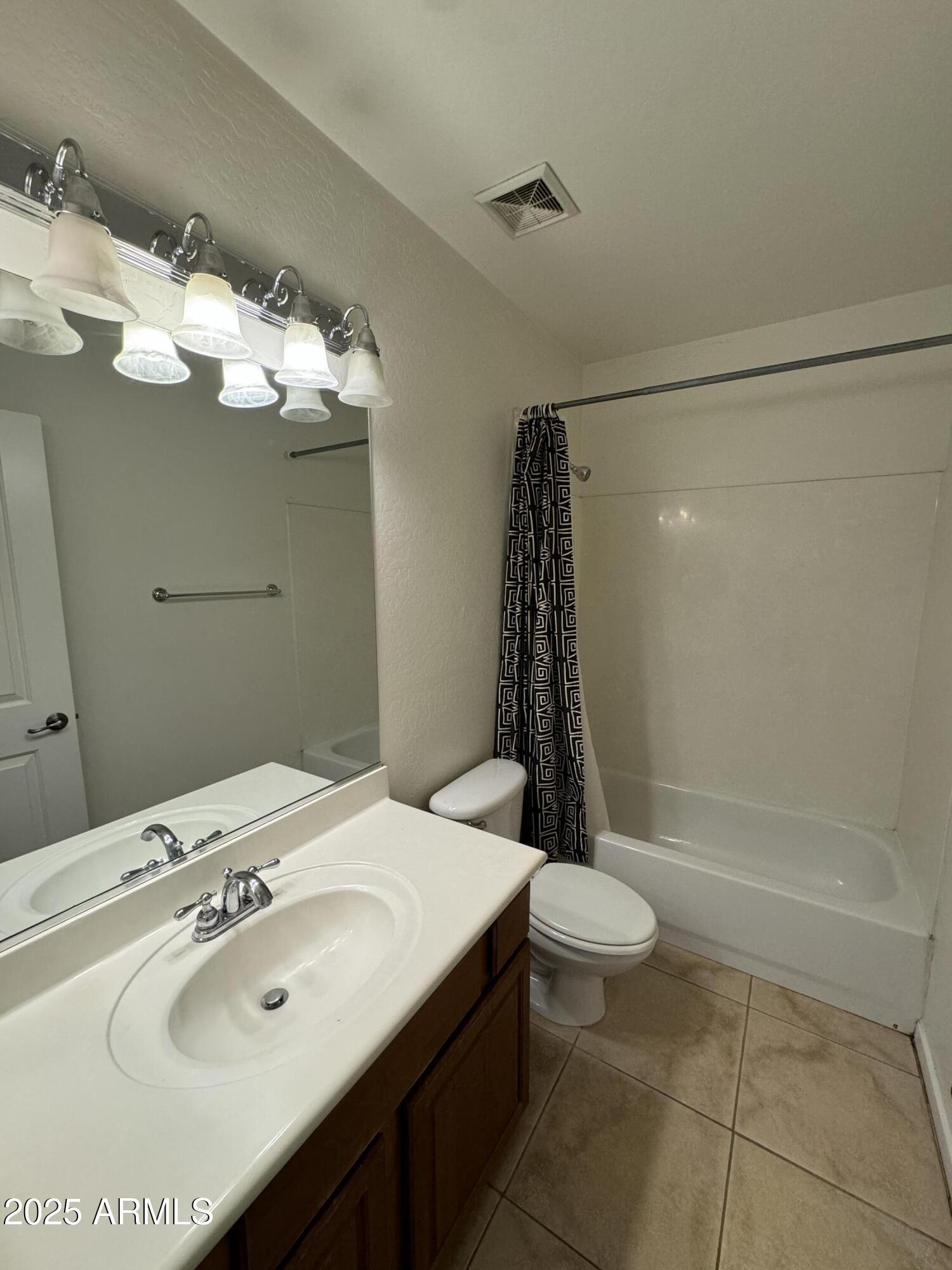 305 South Wilson Street, Unit 111 Tempe, AZ 85281 - Photo 22 of 48 a bathroom with a sink a toilet and a shower