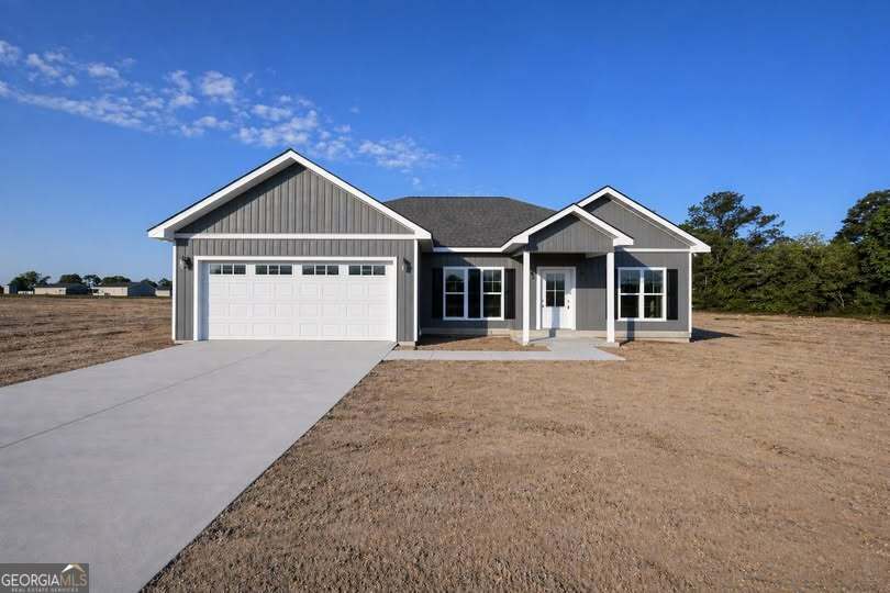 1229 Mark Wood Road Dexter, GA 31019 - Photo 1 of 5 a front view of a house with a yard