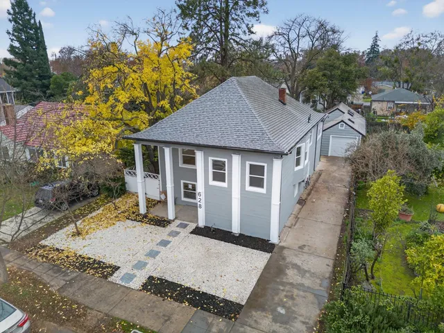 a view of a hallway with wooden floor and entryway