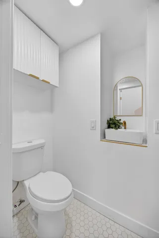 a stove top oven sitting inside of a kitchen