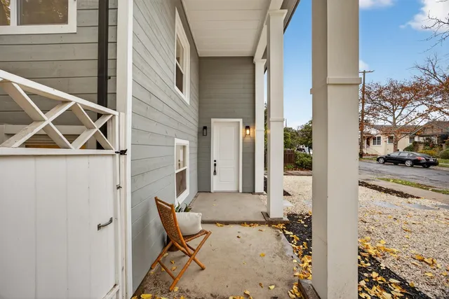 a view of a room with wooden floor and furniture
