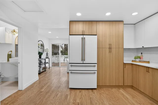 a bedroom with a bed and a potted plant
