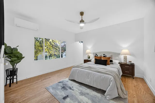 a view of a balcony with wooden floor
