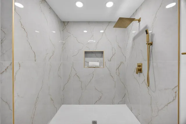 a view of a kitchen with wooden floor and electronic appliances
