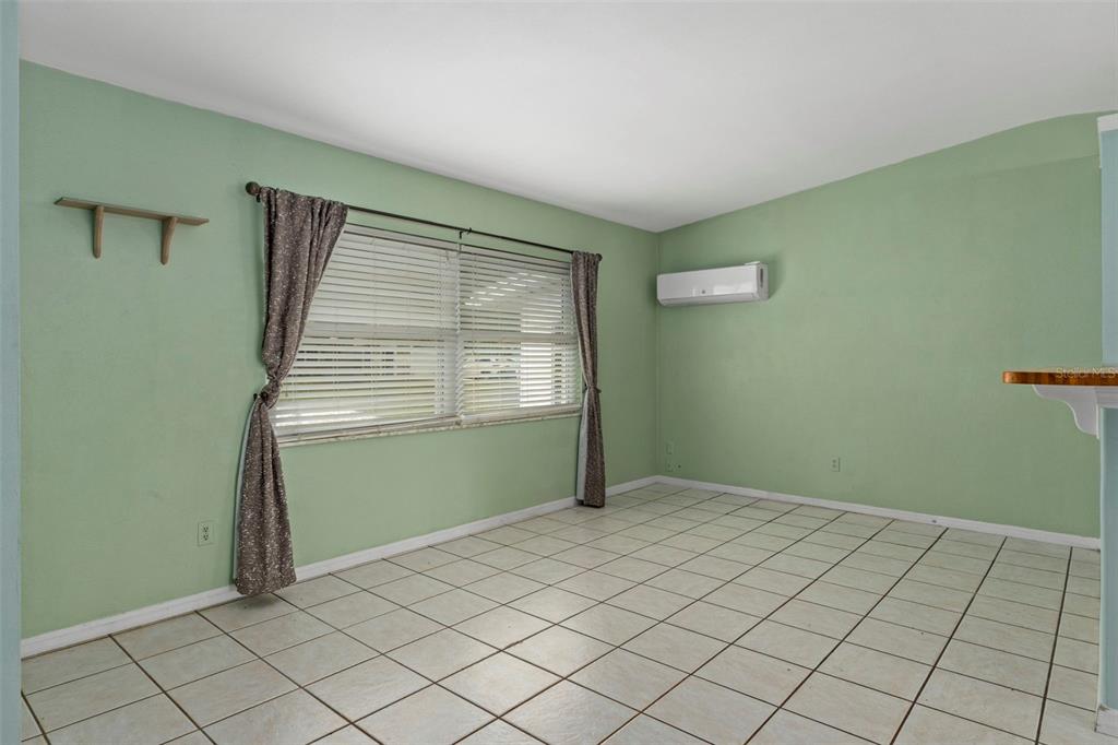6421 Finance Avenue Weeki Wachee, FL 34607 - Photo 11 of 38 an empty room with windows
