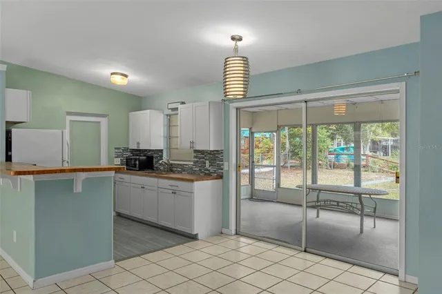 a kitchen with stainless steel appliances granite countertop a sink a stove and a granite counter tops