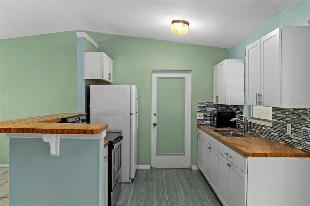 6421 Finance Avenue Weeki Wachee, FL 34607 - Photo 17 of 38 a utility room with washer and dryer