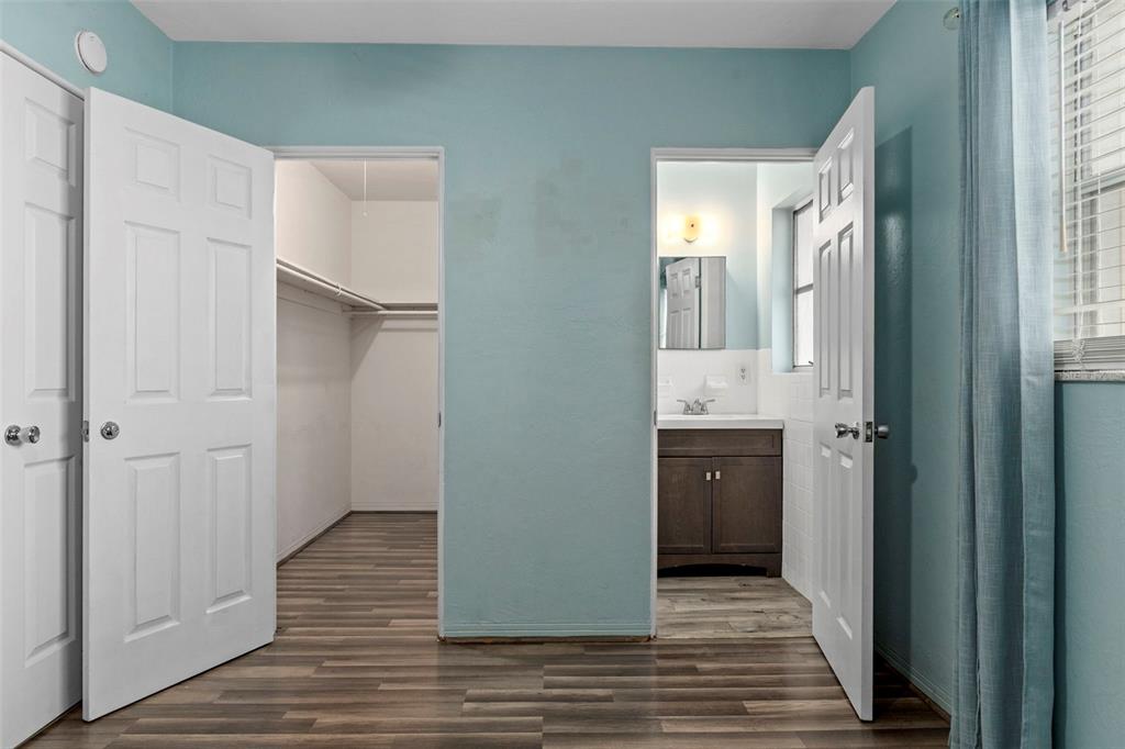 6421 Finance Avenue Weeki Wachee, FL 34607 - Photo 24 of 38 a view of a hallway with wooden floor and staircase