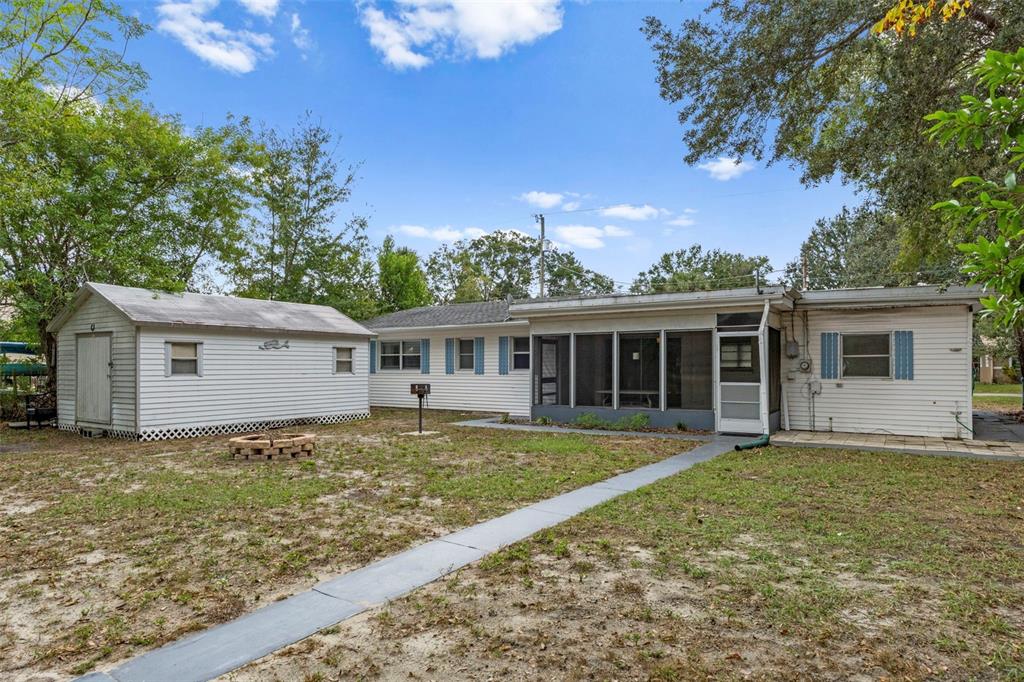 6421 Finance Avenue Weeki Wachee, FL 34607 - Photo 35 of 38 a view of a house with a yard