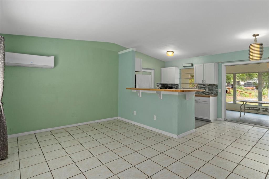6421 Finance Avenue Weeki Wachee, FL 34607 - Photo 10 of 38 a kitchen with stainless steel appliances granite countertop a refrigerator sink and cabinets