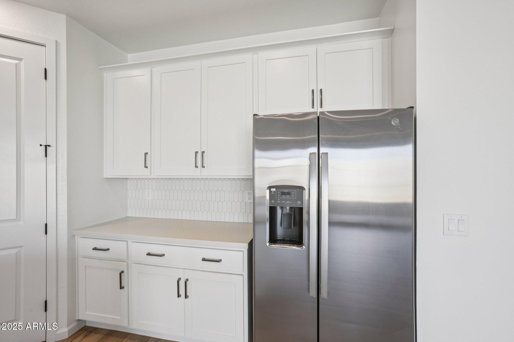 16226 West Bajada Road Surprise, AZ 85387 - Photo 15 of 45 a kitchen with cabinets and stainless steel appliances